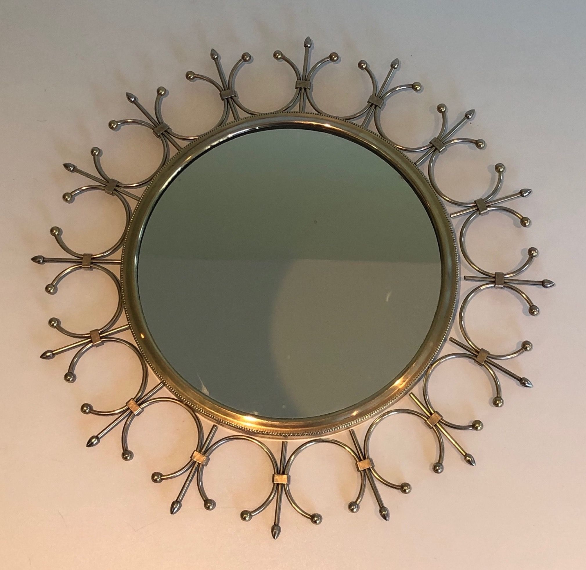 Sun mirror in brass and brushed steel