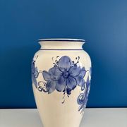 Vintage white and blue ceramic vase with floral pattern