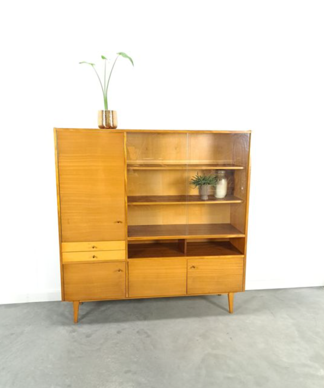 Vintage wooden sideboard with sliding glass doors and drawers