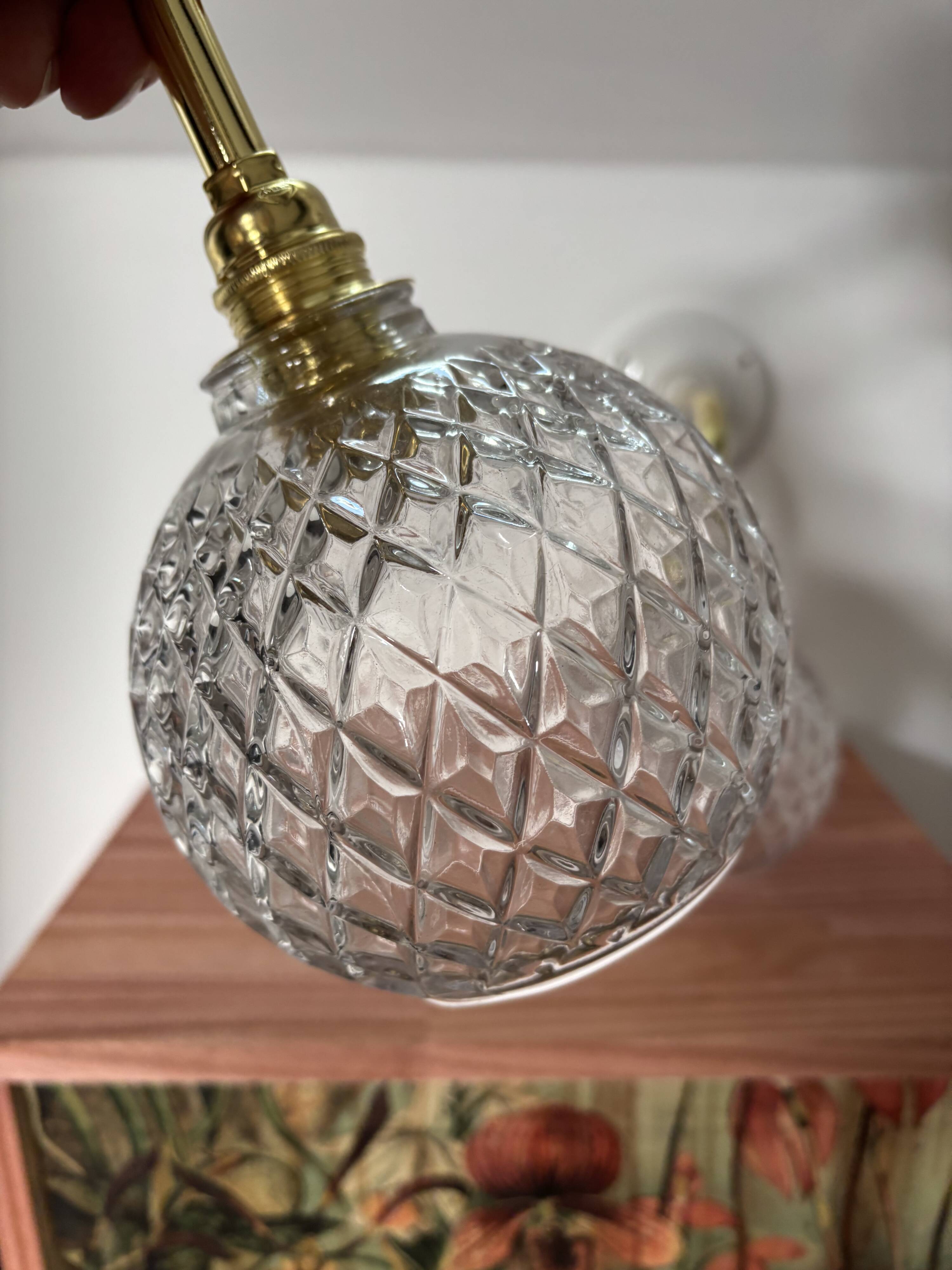 Pair of chiseled glass globe wall sconces