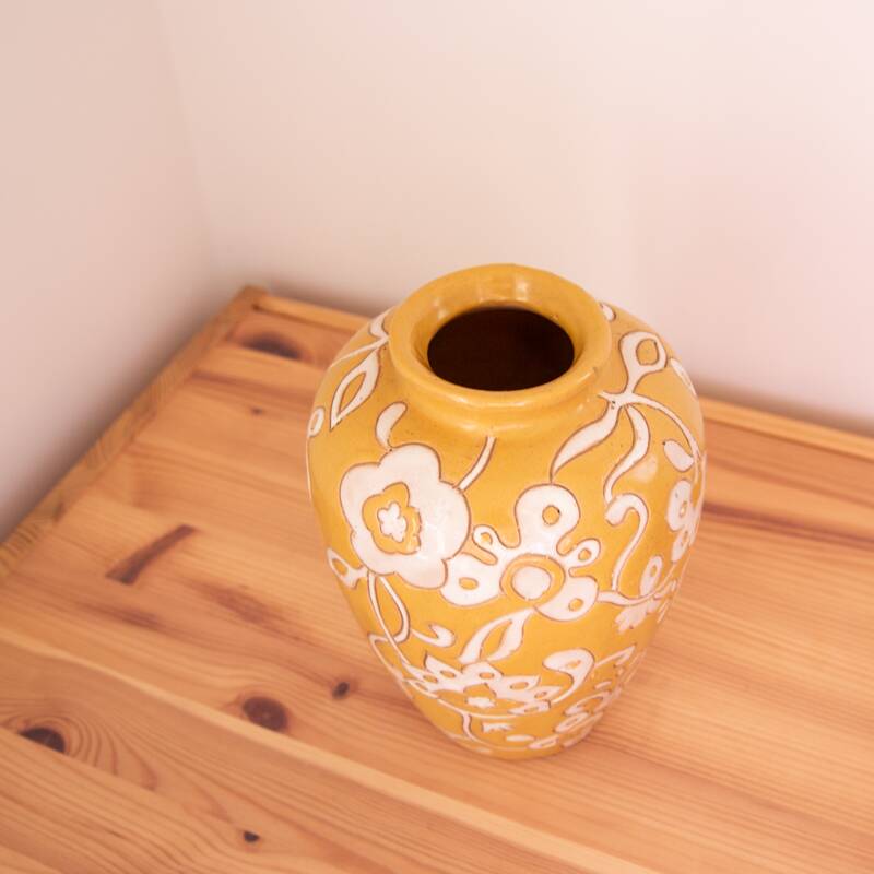 Yellow enamel vase with white flower decoration