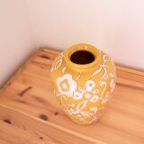 Yellow enamel vase with white flower decoration