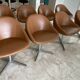 Set of 8 Italian design swivel chairs in cognac leather.