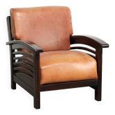 Fauteuil en cuir de vache élégant avec de beaux détails dans un design Art Déco intemporel.