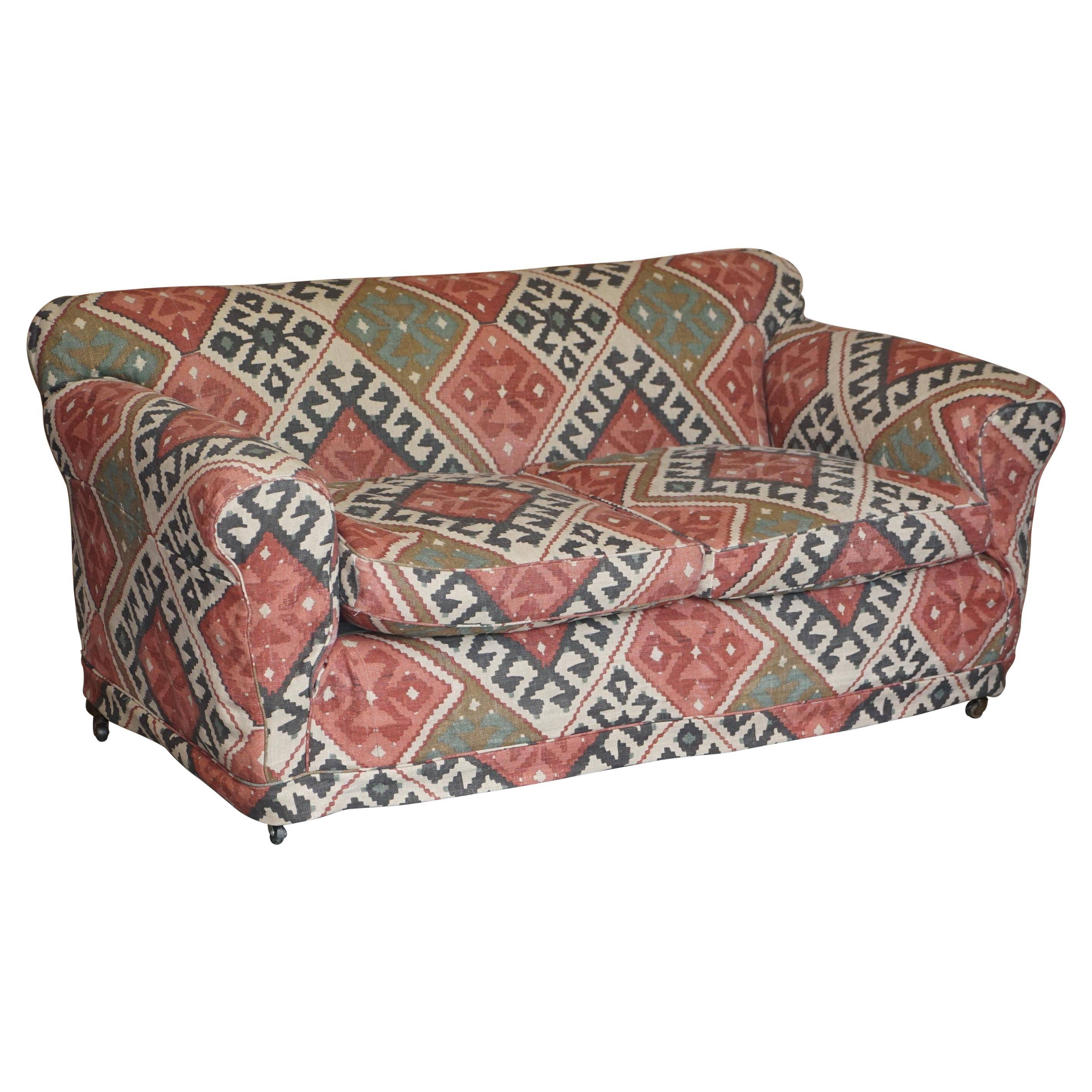 Victorian canapé upholstered in Kilim with turned mahogany legs.