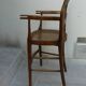 antique caned high chair for children