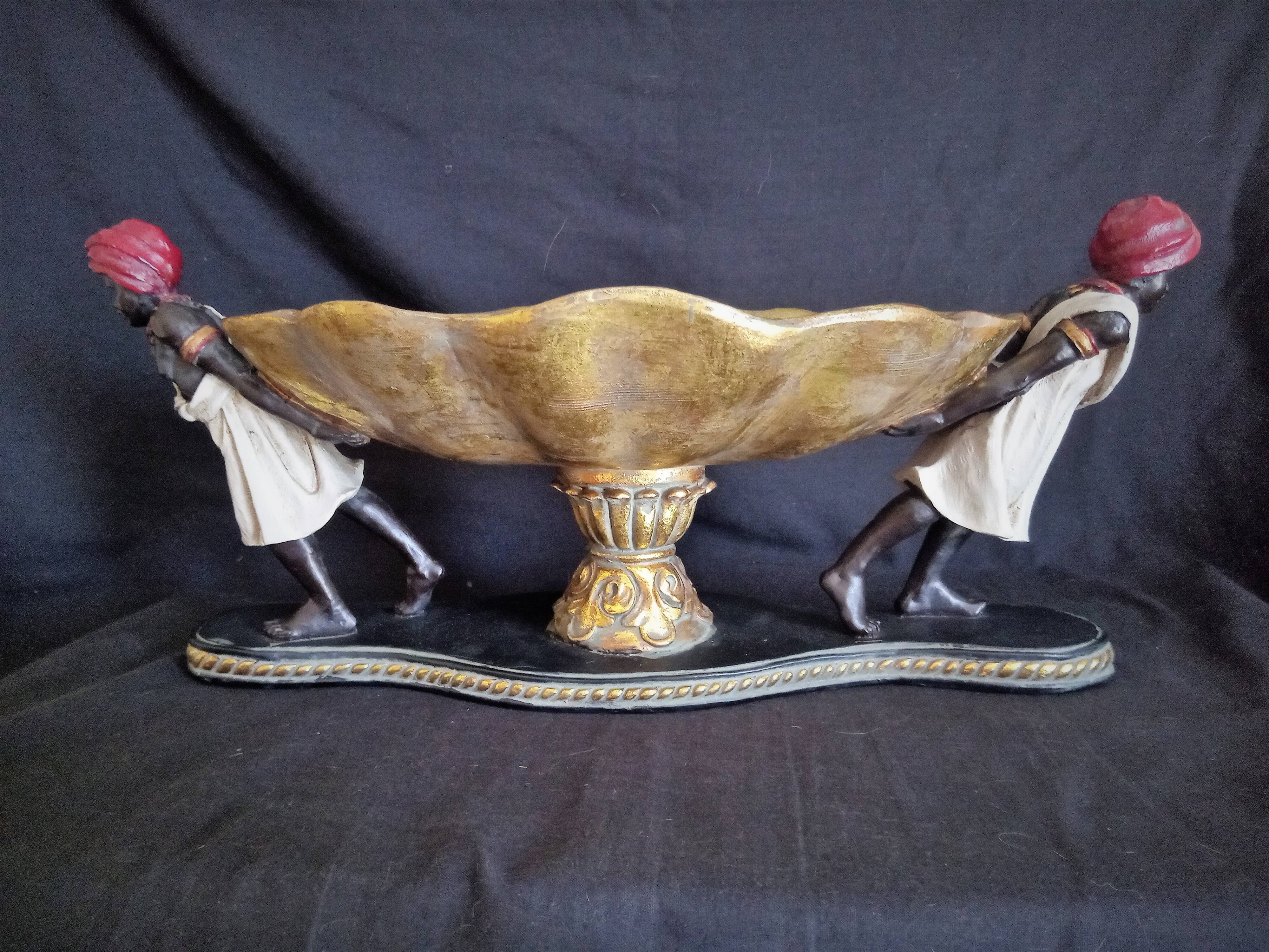 Centerpiece with African characters, plaster, resin and wood
