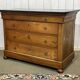 Commode Restauration XIXème en merisier et dessus marbre noir
