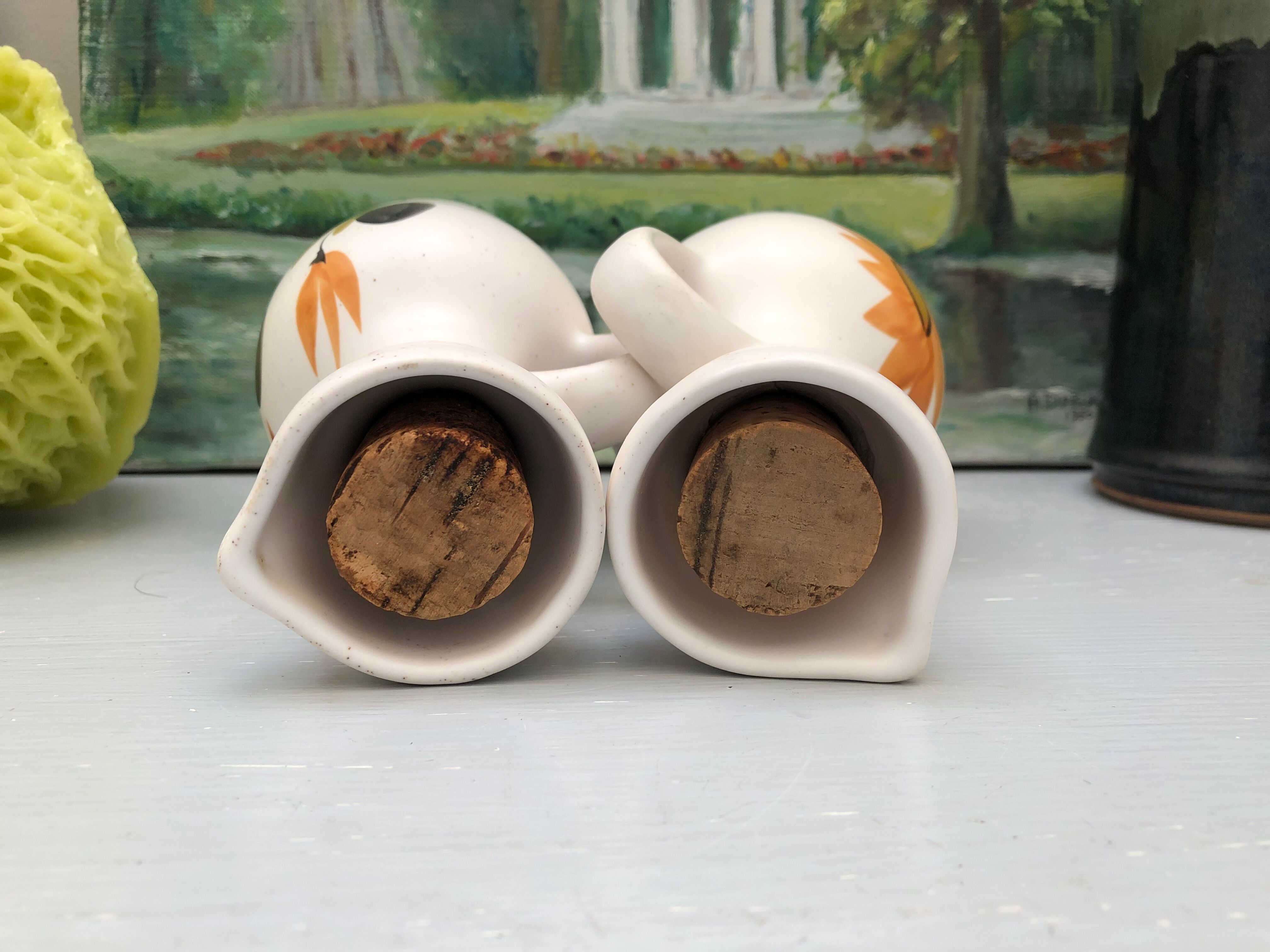 Old vinegar and oil maker with vintage decoration floral motifs