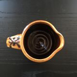 Hand decorated terracotta pitcher