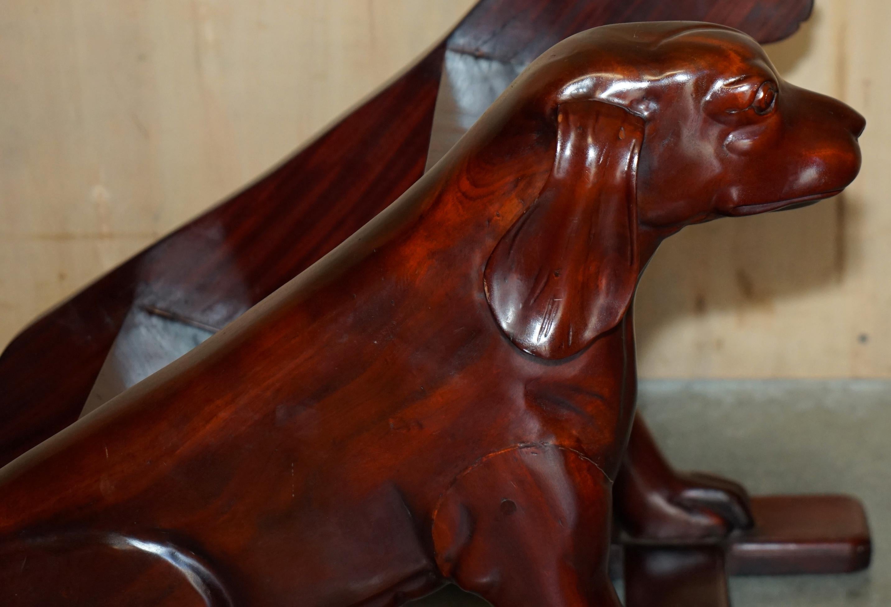 Pair of hardwood library steps with carved dogs, Regency style.