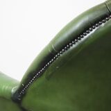 Large green cowhide Chesterfield office chair in English style on wheels