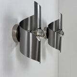 Pair of vintage wall lights, curved patinated steel, France, 1970.