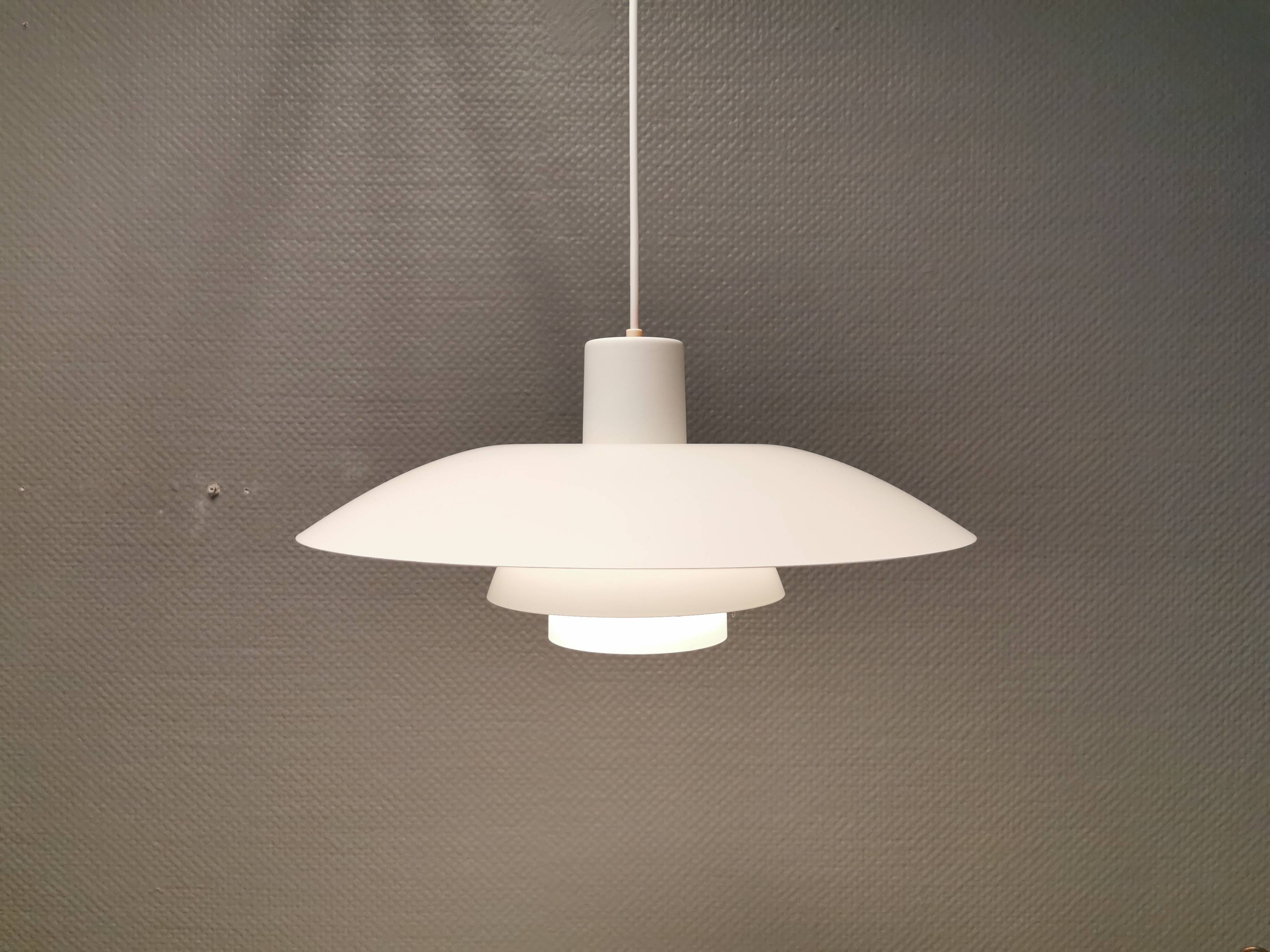 Beautiful older PH 4/3 hanging lamp, in white, with original orange suspension.