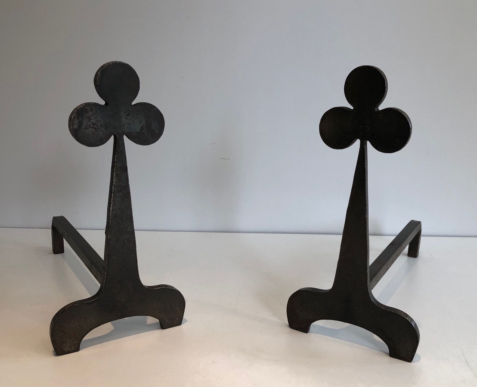 Pair of wrought steel and iron chenets with clover decorations 1950