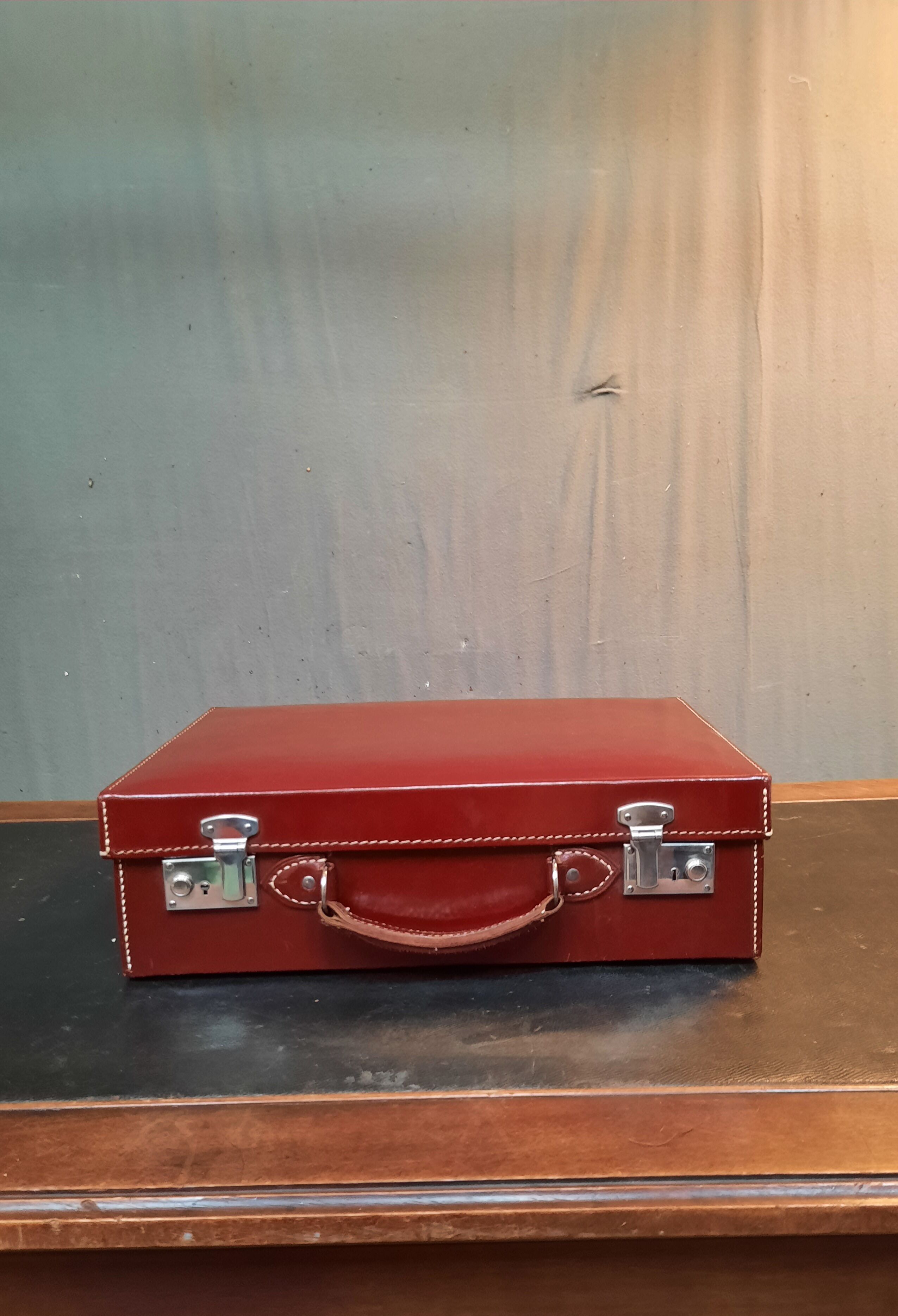 Red leather suitcase