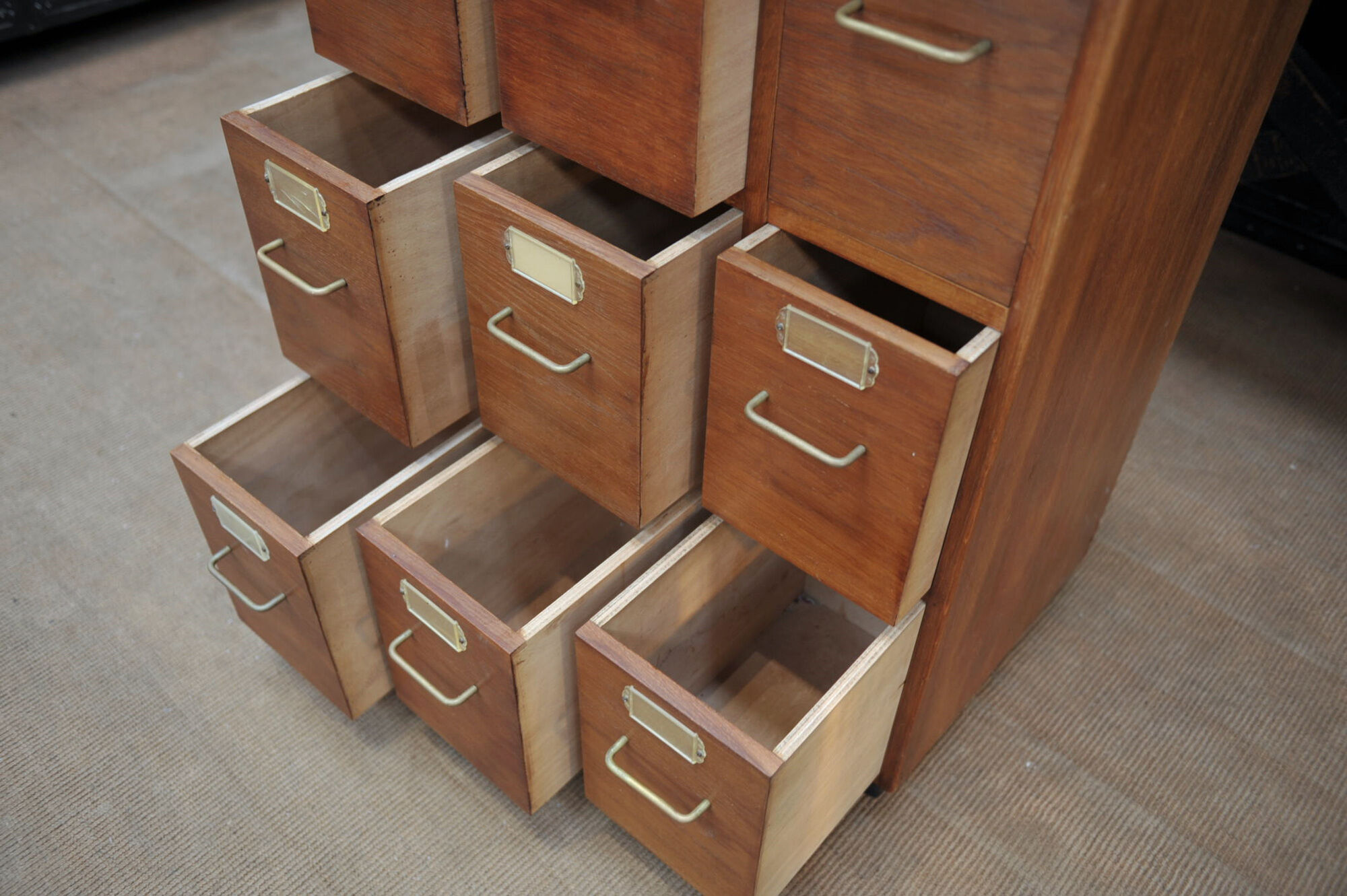 Office furniture has oak drawers 1950 brass handles and label holders