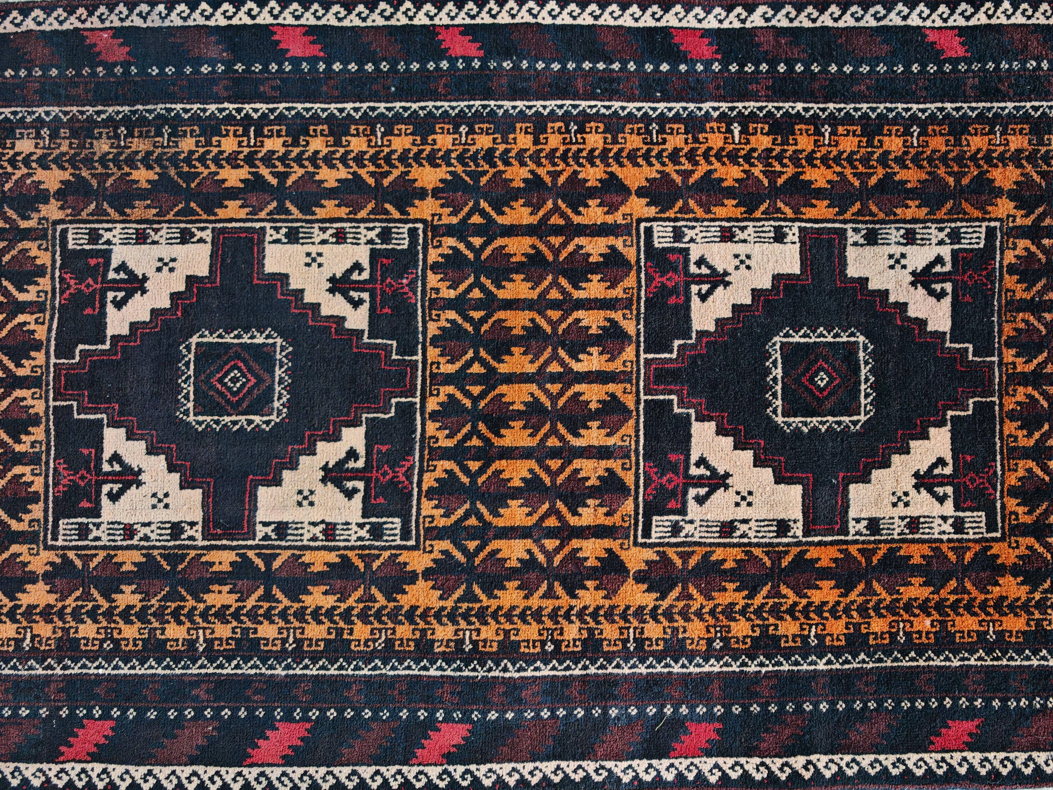 Vintage Persian Baluch rug, hand-knotted wool, 1970.