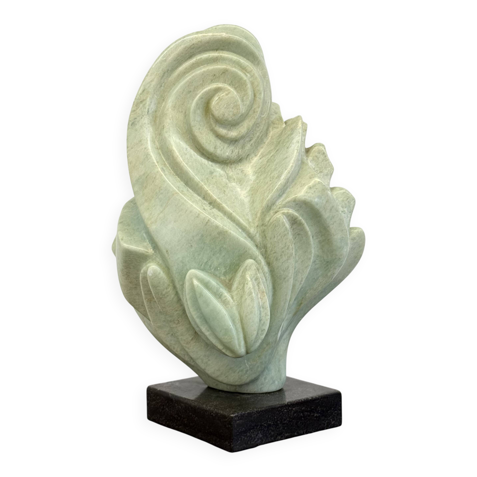 Green natural stone sculpture on marble base