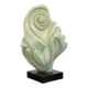 Green natural stone sculpture on marble base