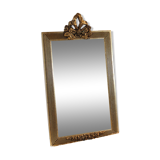 Small rectangular mirror in gilded wood with a pediment decorated with flowers
