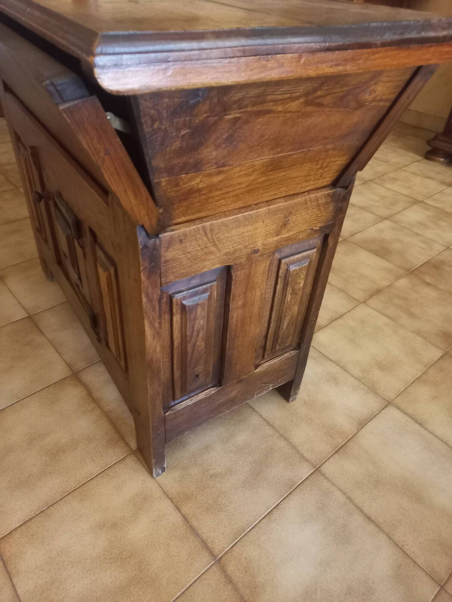 Old solid wood dough mixer carefully transformed into a bar cabinet.