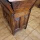 Old solid wood dough mixer carefully transformed into a bar cabinet.