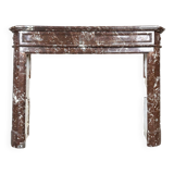 Red marble fireplace in the Louis XVI style, late 19th century