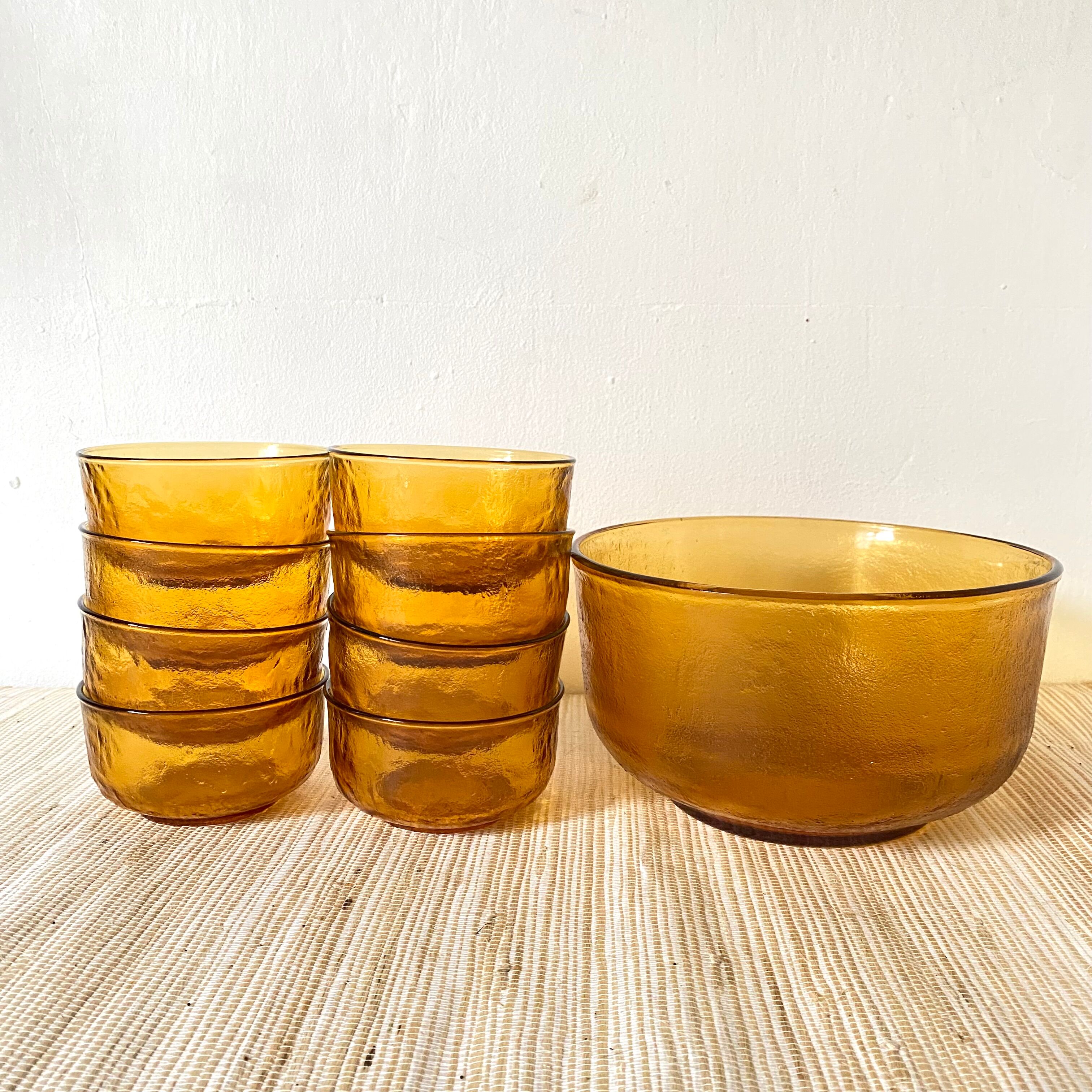 Salad bowl and bowls in amber glass, 70s