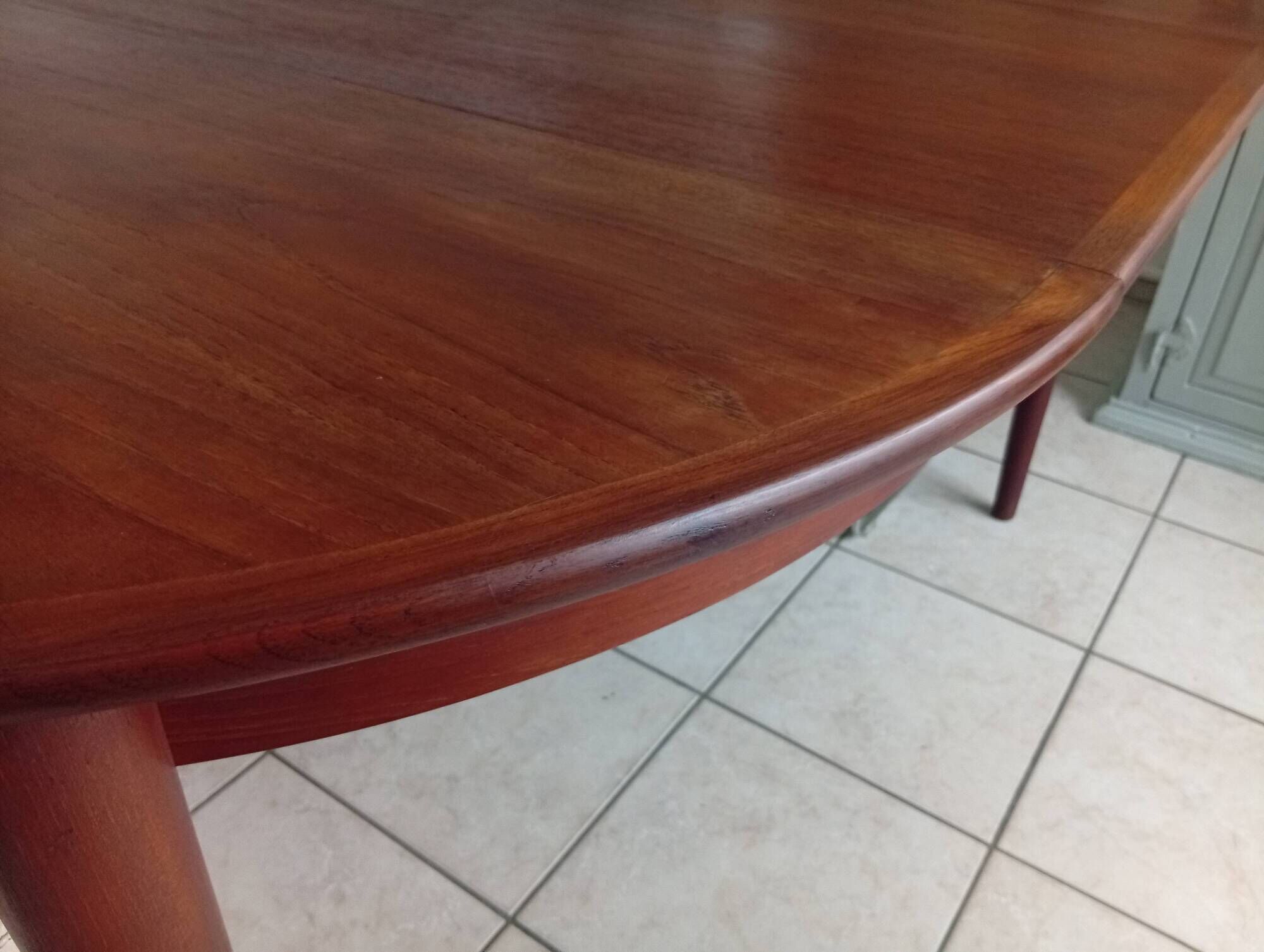Round teak table by Johannes Andersen for Mobler Samcom Scandinavian.