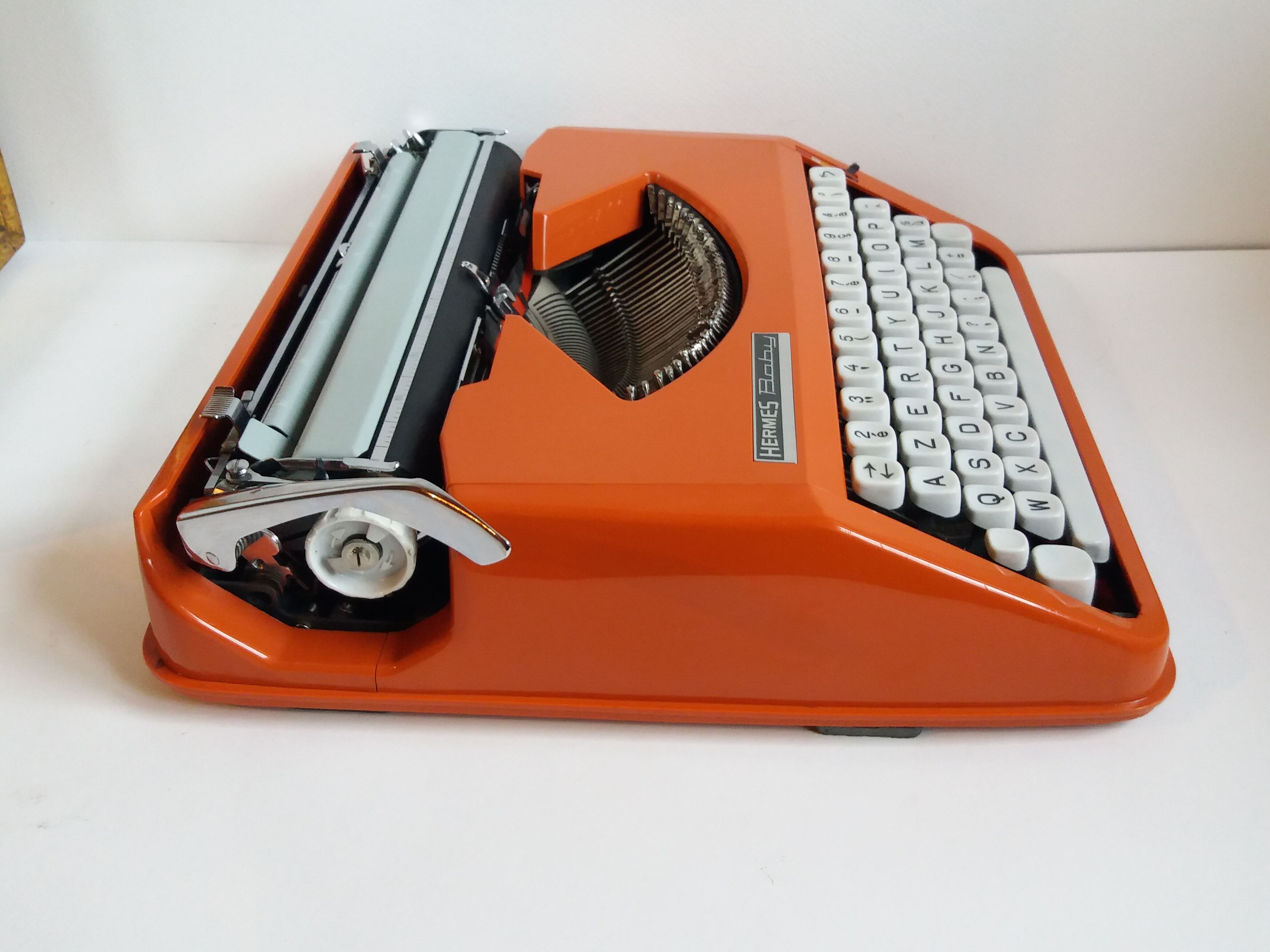Hermes Baby orange typewriter