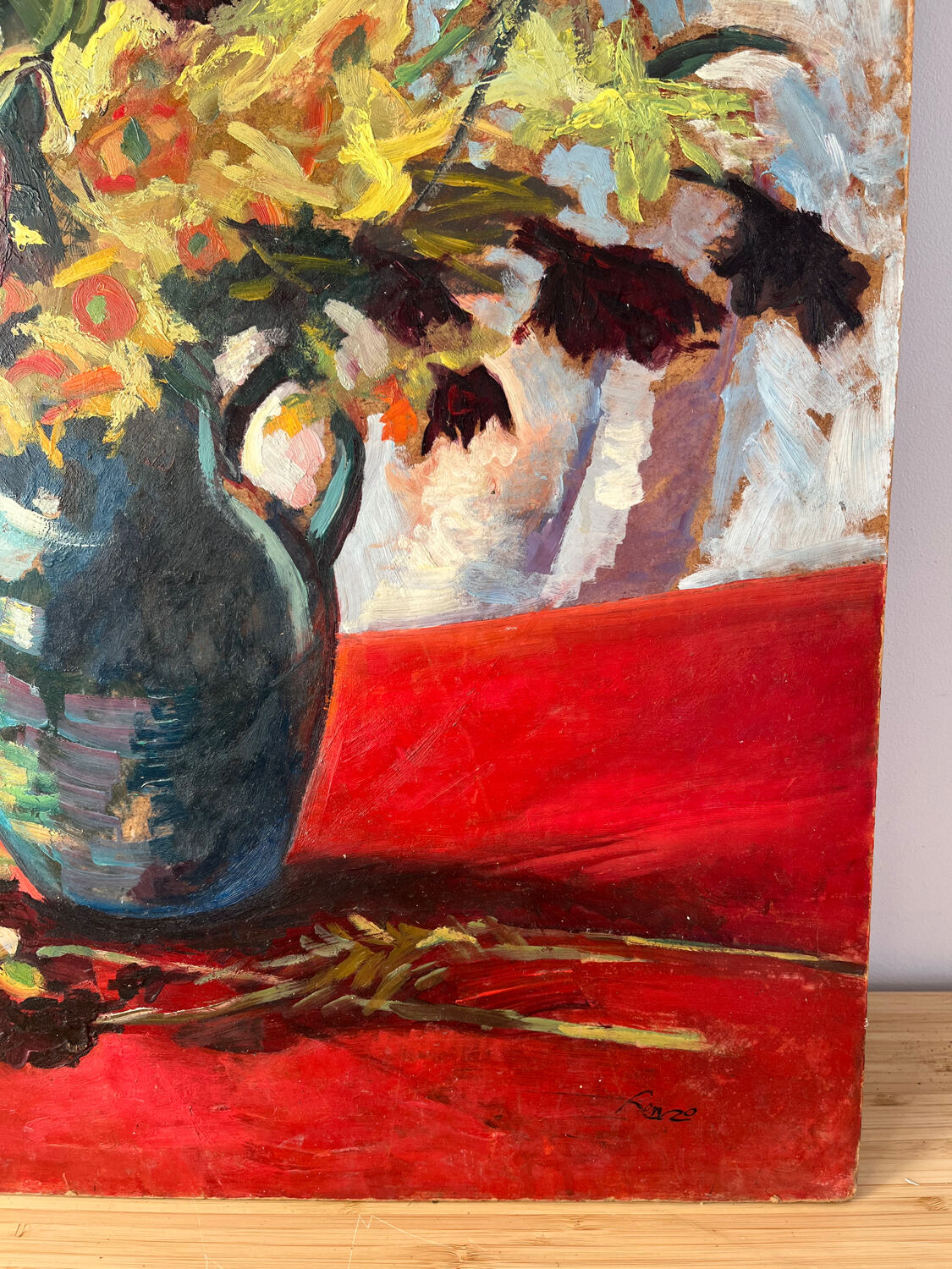 Bouquet of flowers on a red tablecloth, knife on a board, signed Renzo.