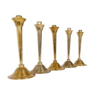 Mid-century set of 5 brass candlesticks by Lars Holmström, Arvika, Sweden.