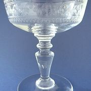 Suite of six champagne glasses on foot in engraved colorless crystal