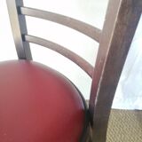 Set of 8 bistro chairs in vintage red wood and leatherette.