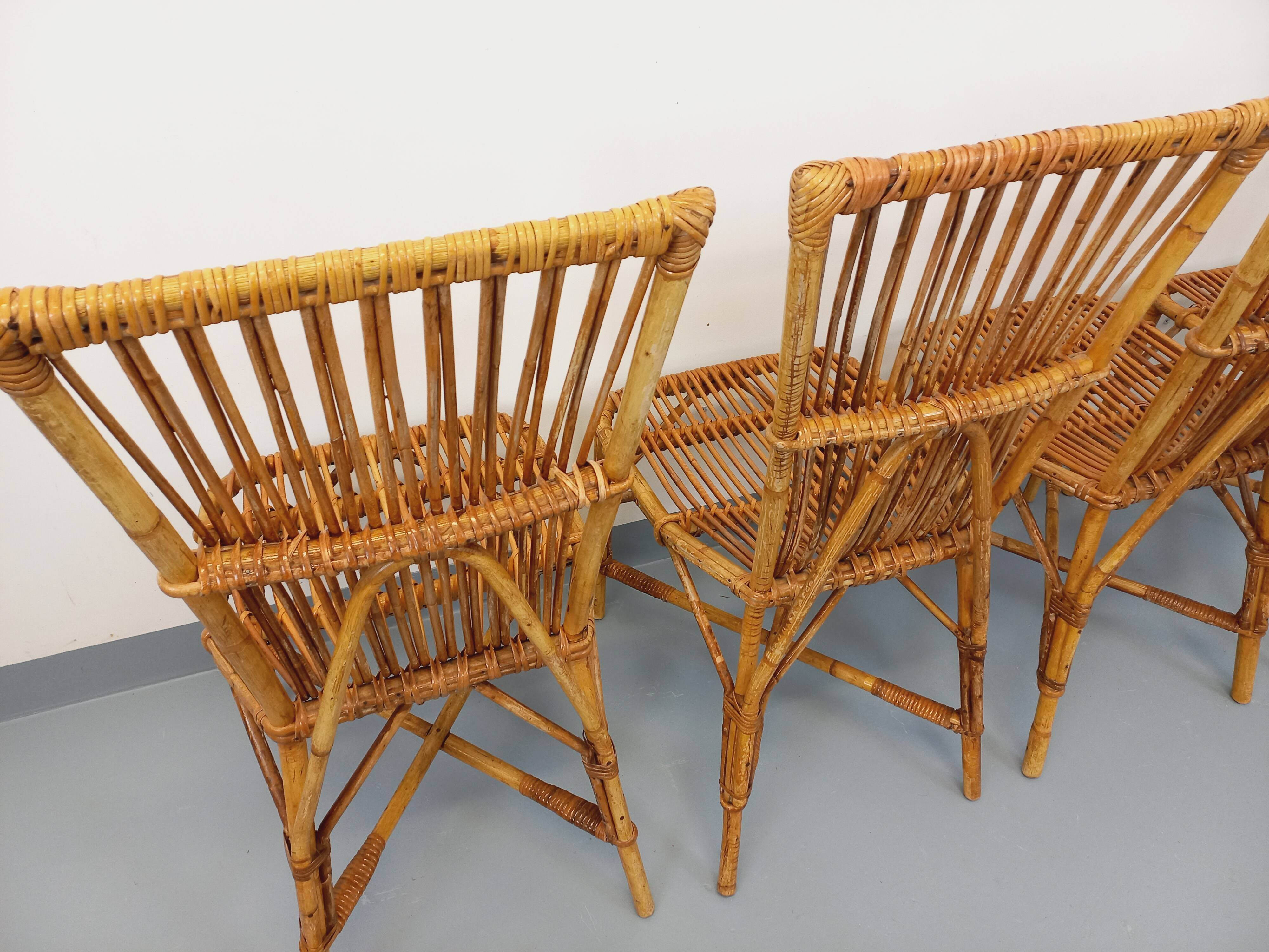 Set of 4 vintage Audoux Minet rattan chairs from the 1950s and 60s.