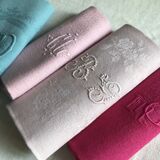 Suite of four antique tinted napkins