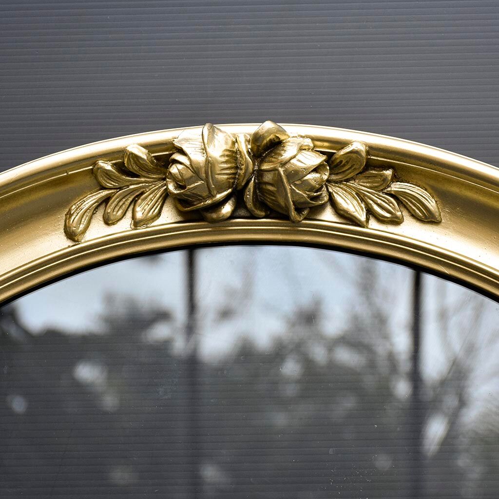 Delightful empty old gilded oval frame with carved wood and stucco flowers 63 x 53
