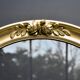 Delightful empty old gilded oval frame with carved wood and stucco flowers 63 x 53
