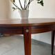 Extendable round table in Rio rosewood.