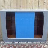 Showcase with sliding doors in painted wood