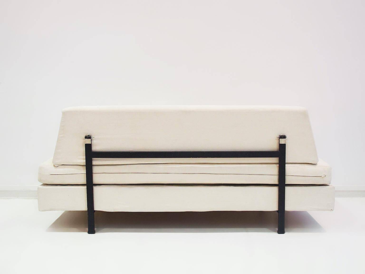 Italian modernist daybed with white upholstery and iron frame.