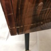 Lacquered 3-drawer chest with rosewood veneer.