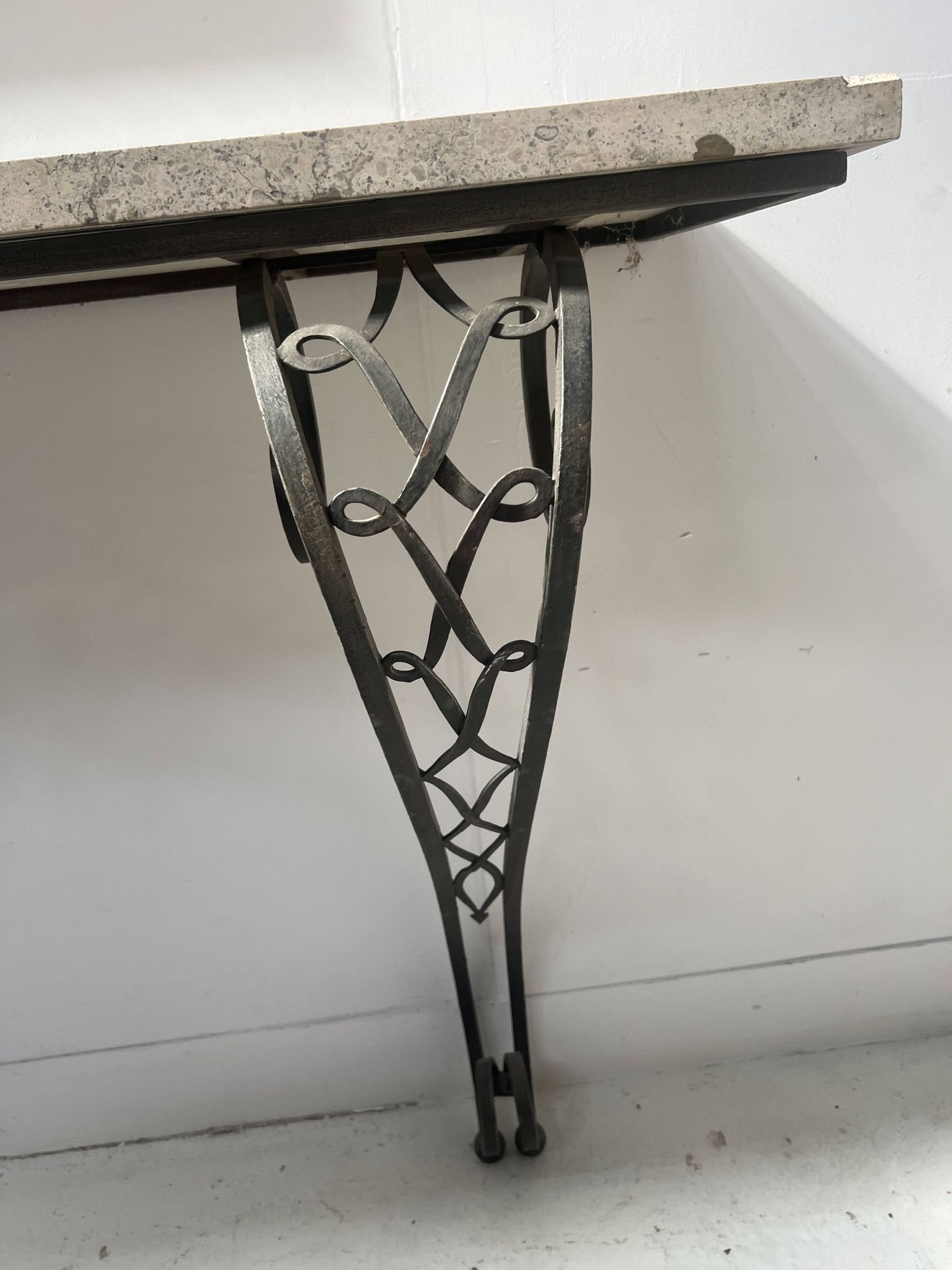 Art Deco console in hammered wrought iron, 20th century.