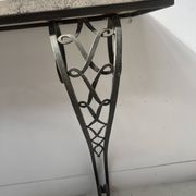 Art Deco console in hammered wrought iron, 20th century.