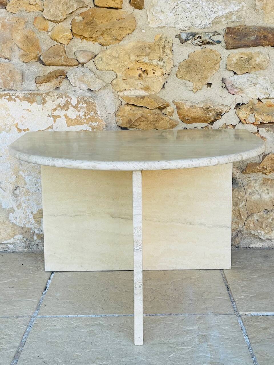 Vintage side table in travertine, circa 1980s.