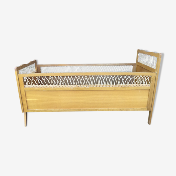 Wooden and wicker baby bed