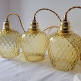 Trio of yellow glass pendant lights