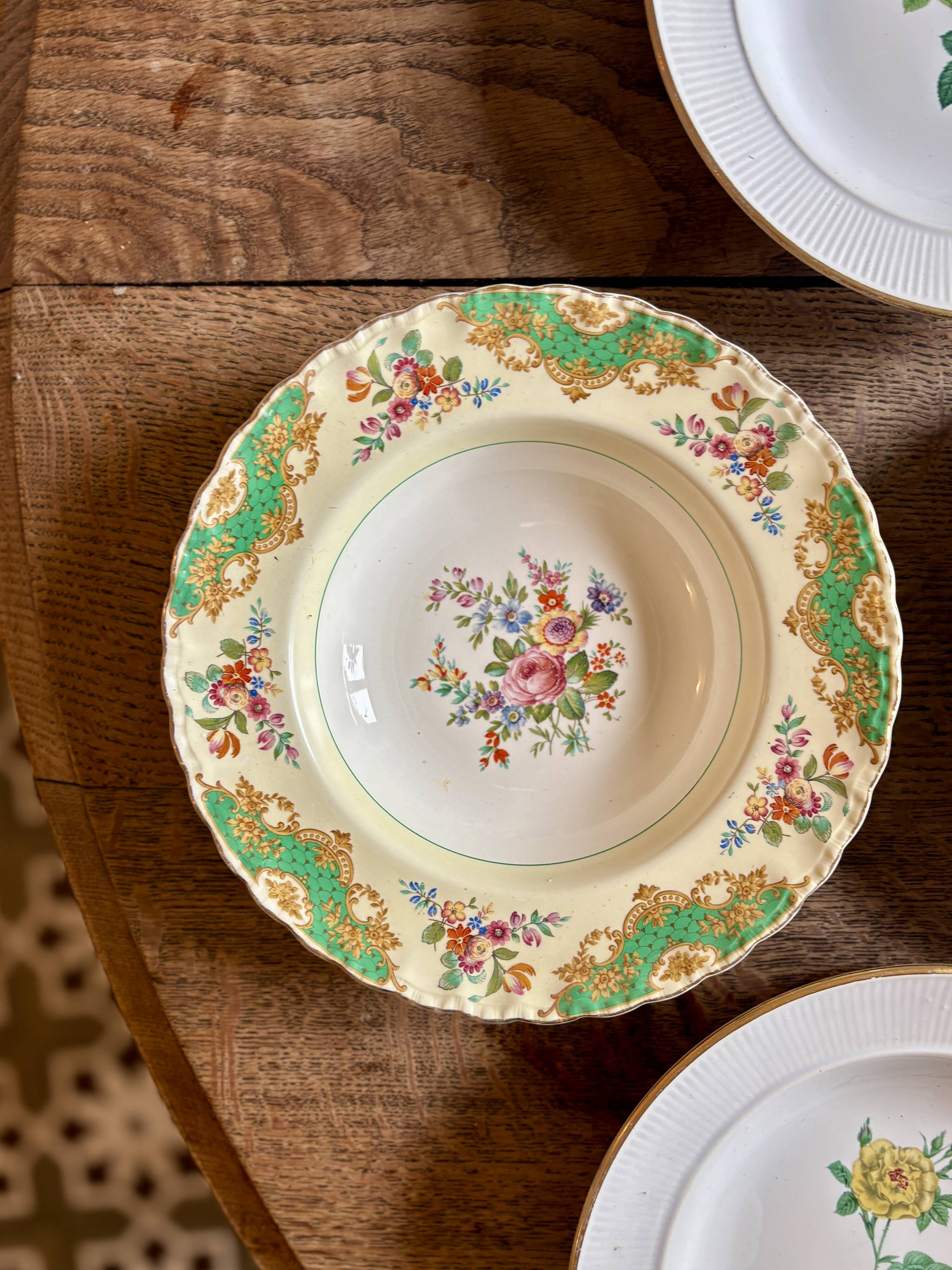 Set of 6 mismatched antique deep plates.