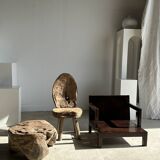 Small low armchair in varnished brown wood